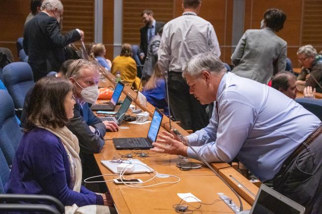 Delegates confer