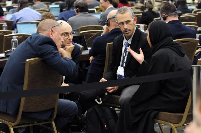 Delegates from Israel confer during the Committee session