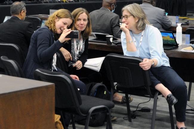 Delegates from the Netherlands enjoy a moment before plenary