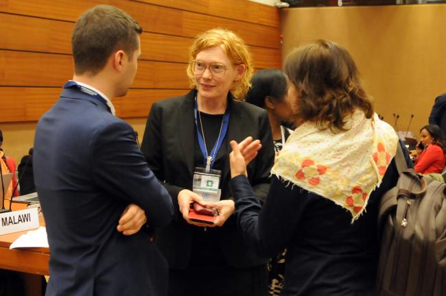 Participants confer between sessions