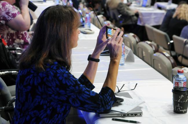 A participant records the intervention made by David Applegate, Director, US Geological Survey