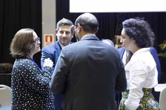 Delegates huddle during the informal consultations