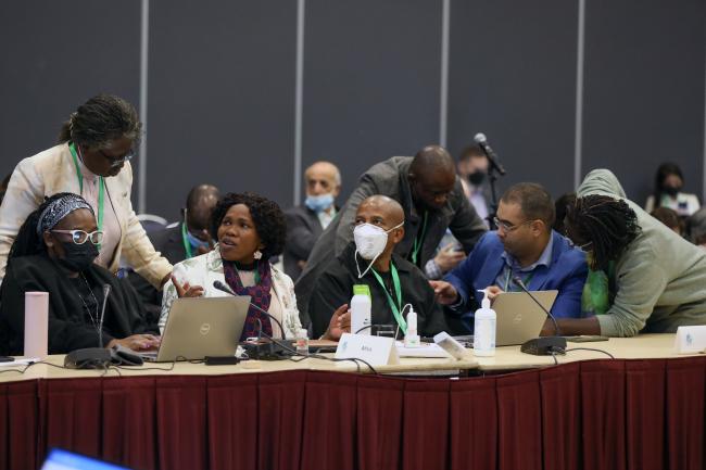 Delegates conferring during a small break