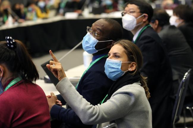 Delegates conferring