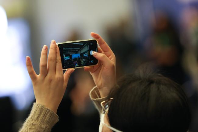 Delegate takes a photo