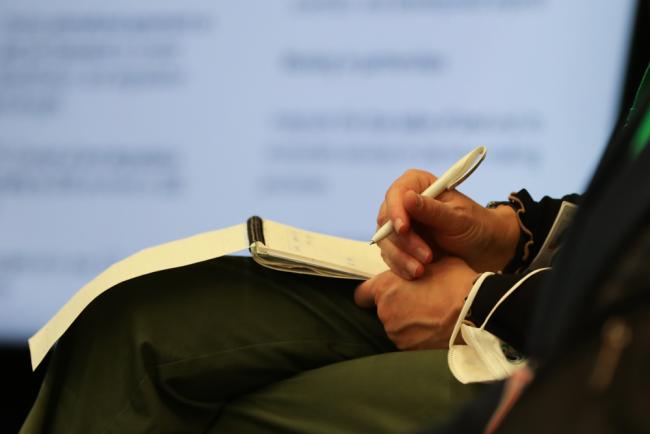 Delegate takes notes