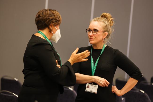 Katie Critchlow, Nature Metrics, greets participants_SideEventsCBDCOP15_10Dec2022_Photo.jpg