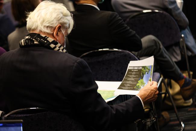 Participant reads event materials_SideEventsCBDCOP15_9Dec2022_Photo.jpg