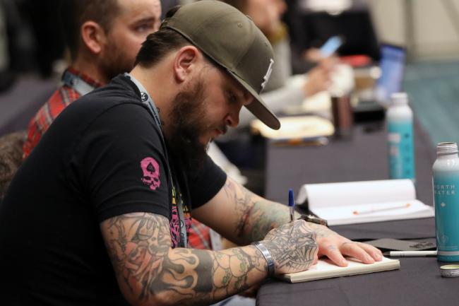A participant taking notes 