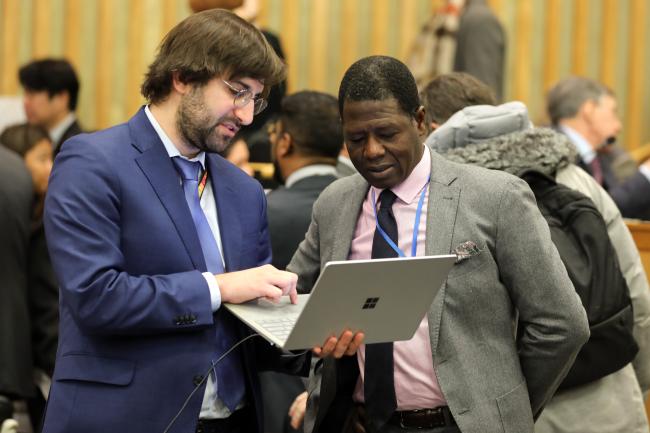 Delegates from Monaco conferring during a break