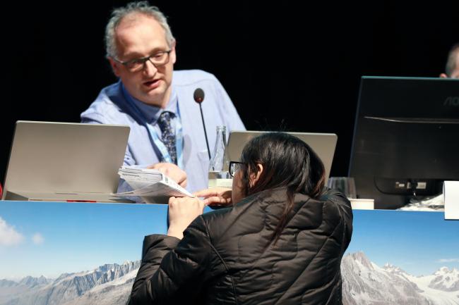 A chinese delegate asking for a clarification on the report 