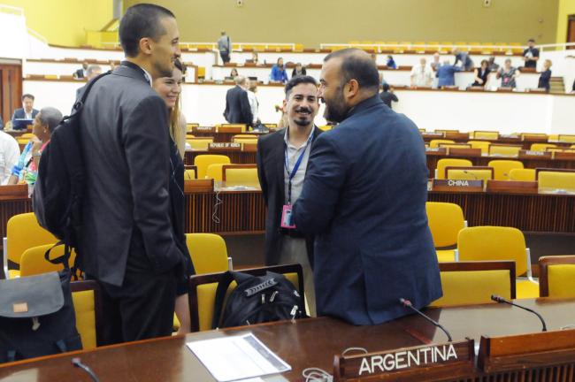 Delegates from Argentina and Chile confer