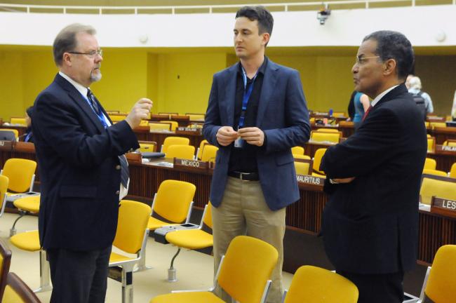 Delegates from Canada and Morocco confer