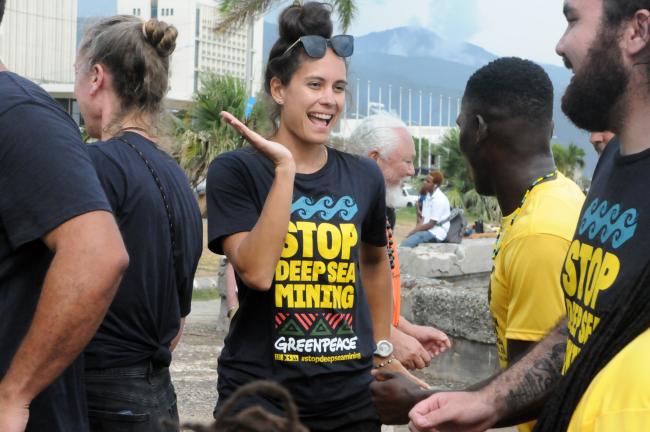 Greenpeace representative dances