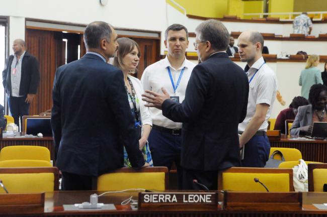 Delegates from the Russian Federation discuss informally