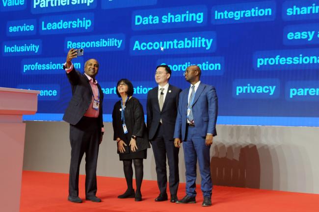 Panel speakers take a selfie at the end of the session