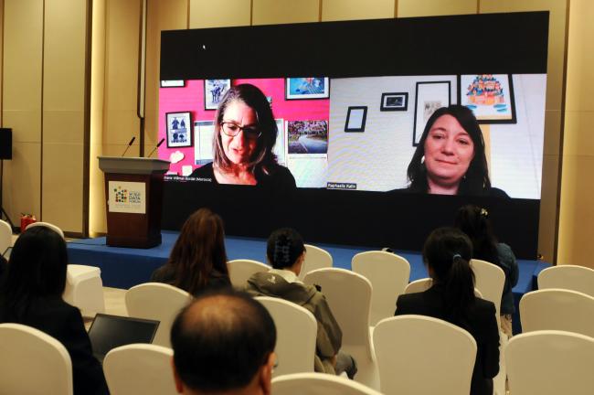 Participants watch a pre-recorded video with Stephanie Willman Bordat,  Mobilising for Rights Associates (MRA), and Raphaëlle Rafin, UN Women