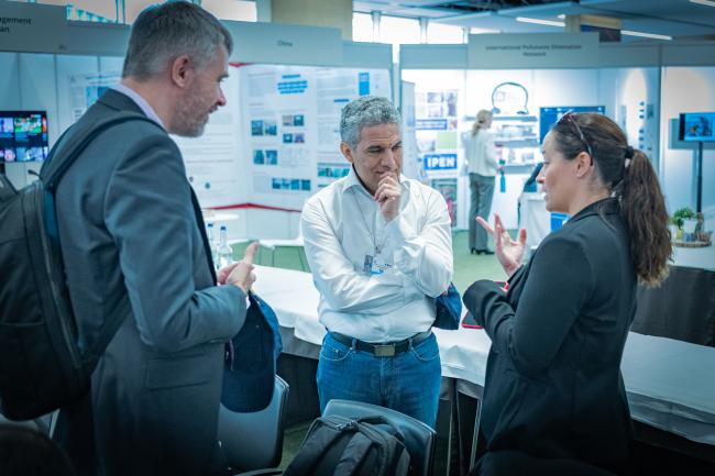 A group of attendees haring countries’ experiences and lessons learned on PCB elimination