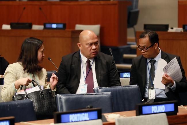 Delegates from the Philippines conferring during a break