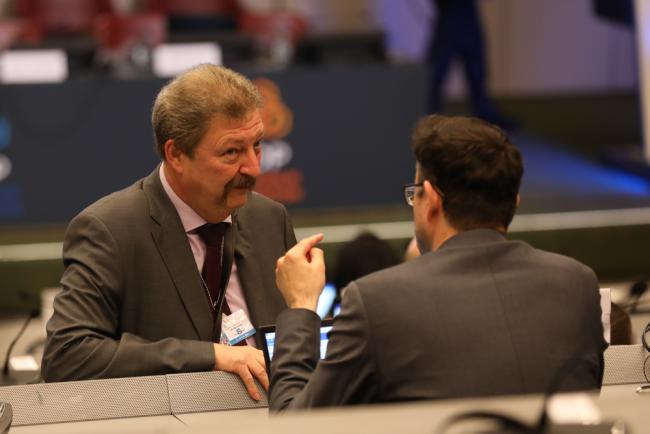 Delegates speak informally