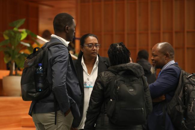 Delegates speak informally