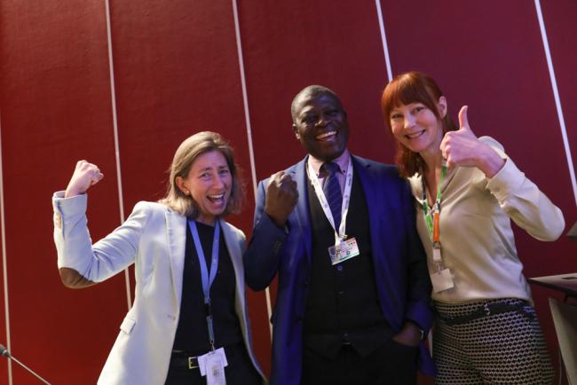 Juliette Kohler, BRS Secretariat, and Stockholm Compliance Contact Group Co-Chairs Sam Adu-Kumi and Tuulia Toikka celebrate the adoption of the compliance mechanism