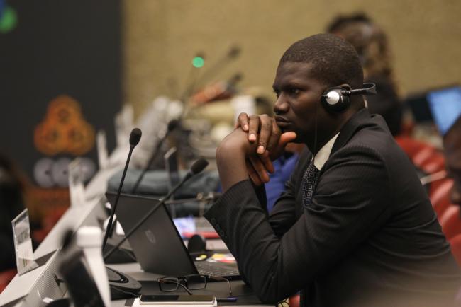 Delegates listen to the proceedings