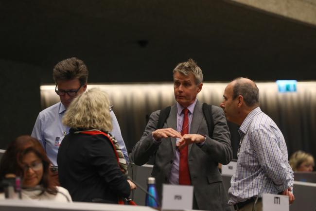 Delegates speak informally