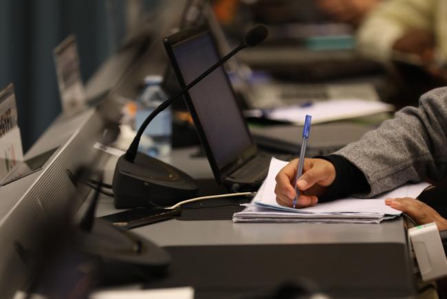 Delegate takes notes