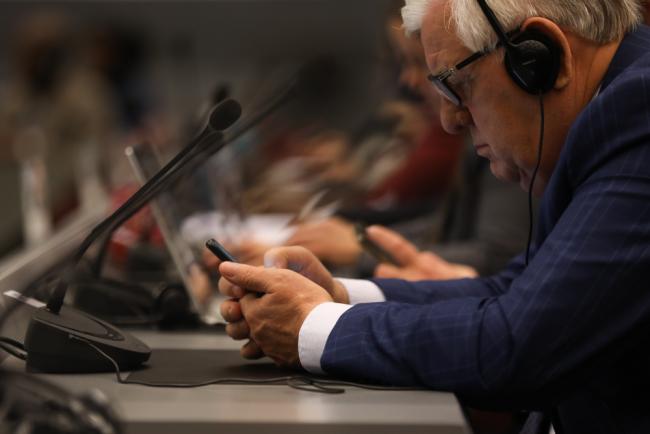 Delegates on phone