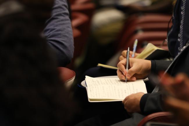 Delegates take notes