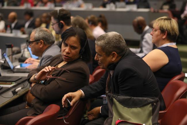 Delegates from Cuba consult
