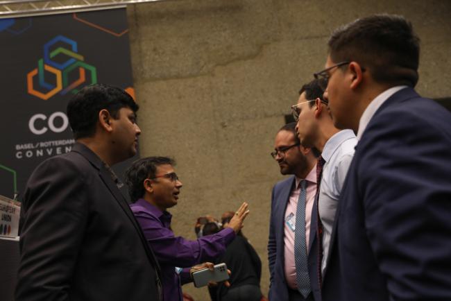 Delegates from India and Colombia huddle