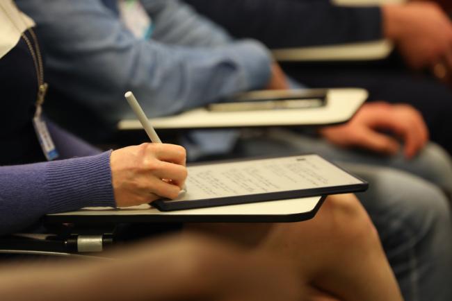 Delegates take notes