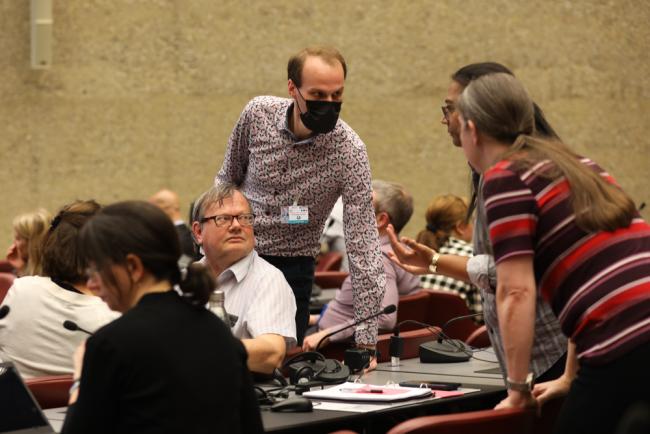 Delegates consult during the Basel Convention Technical Matters Contact Group