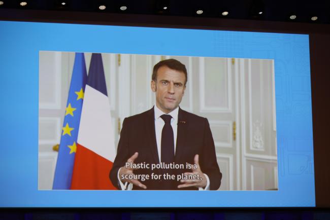 Emmanuel Macron, President of France, delivers an address by video
