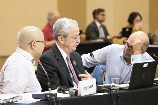 Elected Chairperson Tom Bui, Canada; William Ehlers, GEF Secretariat; and Carlos Manuel Rodríguez, GEF CEO and Chairperson - GEF64 - 29 June 2023 - Photo