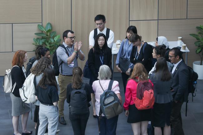 Delegates huddle informally