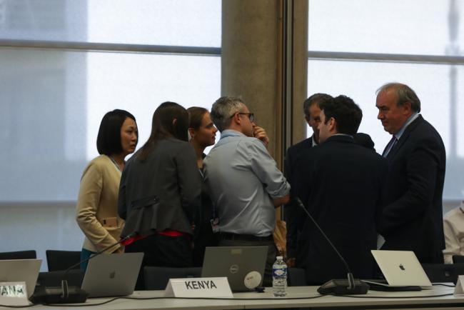 Developed and developing countries huddle during the informal consultations on research and systematic observation