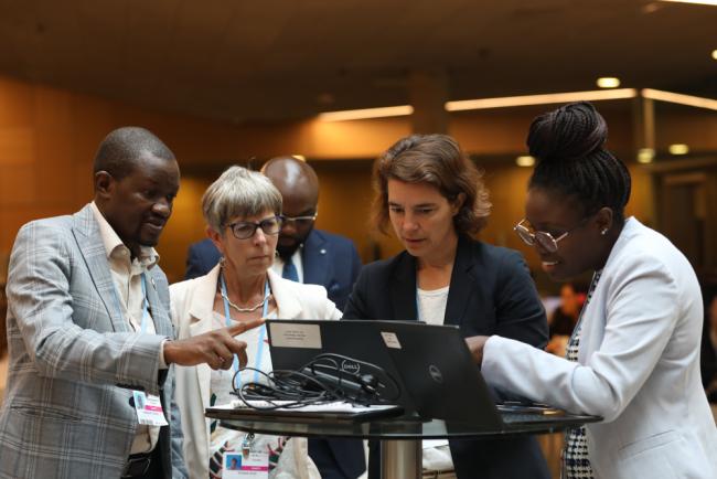 Co-Facilitators for research and systematic observation Ladislaus Chang'a, Tanzania, and Elizabeth Bush, Canada, consult with the UNFCCC Secretariat