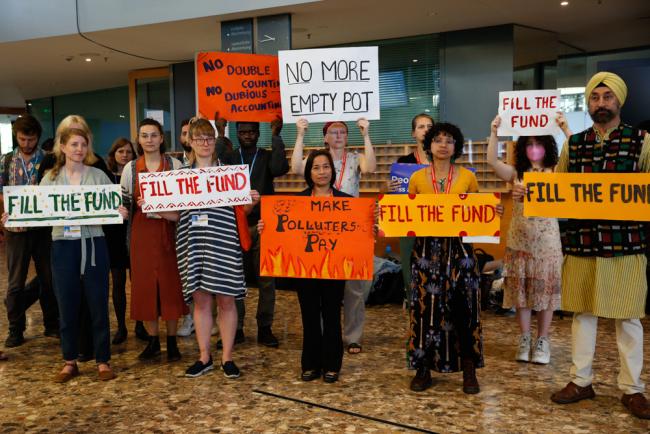 As discussions on the Glasgow Dialogue begin, members of civil society demonstrate simultaneously in three separate locations, calling for 'polluters to pay' and to 'fill the fund' for loss and damage