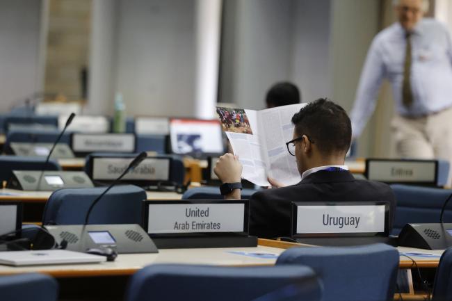 A delegate reading a brochure 