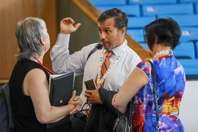 Delegates conferring before the morning session