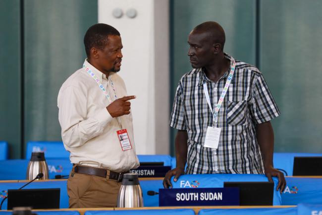 Thabo Tjikana, South Africa, with David Peter Mina, South Sudan