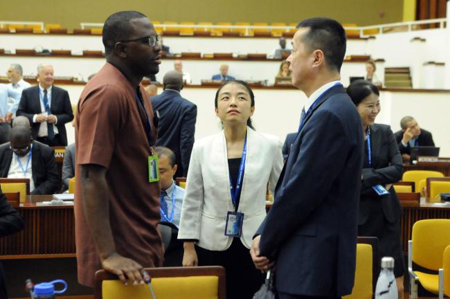 Chinese delegates confer