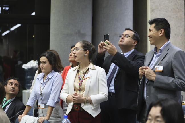 Delegates waiting for the results to appear on the screen