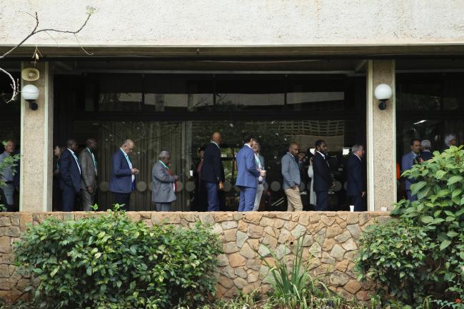 Delegates waiting in a line to coleect their voting badges 