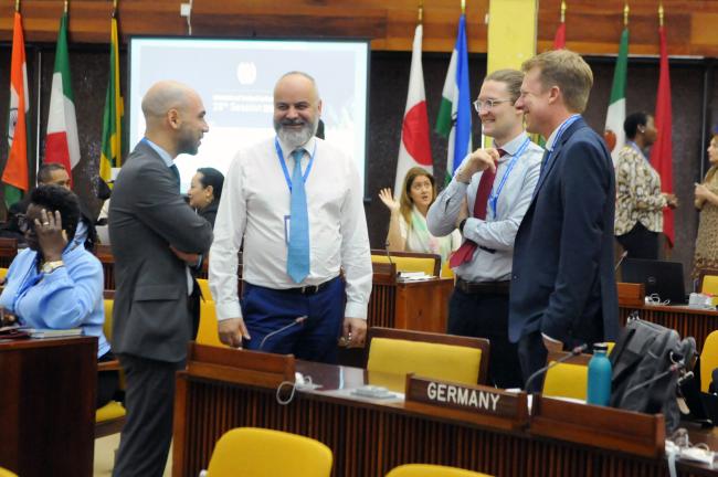 Delegates from Belgium and Germany before the start of Thursday’s proceedings.