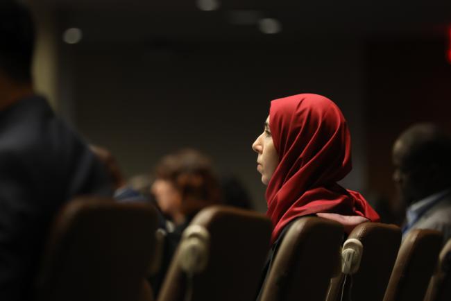 Delegate listens during session