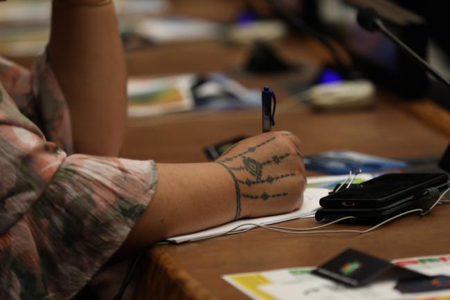 Delegate takes notes